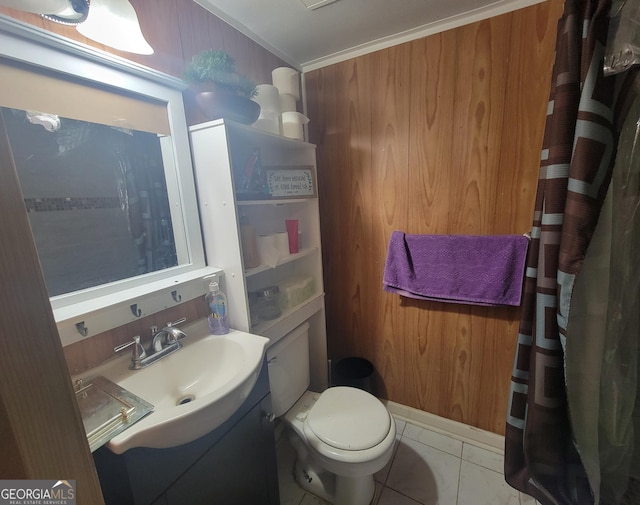 bathroom with toilet, ornamental molding, vanity, and tile patterned flooring