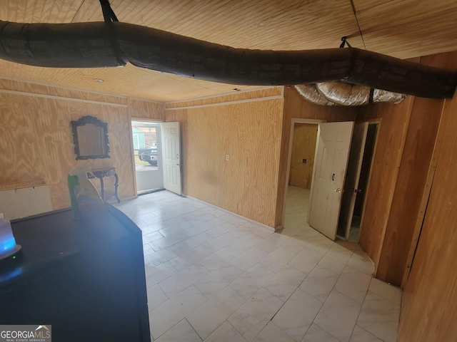 interior space with wooden walls and wood ceiling