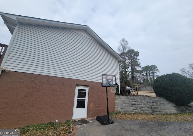 view of side of home with stucco siding