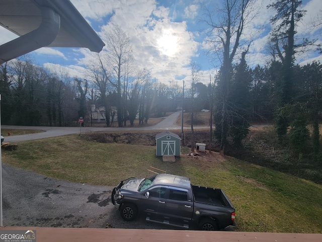 view of yard with a shed and an outdoor structure