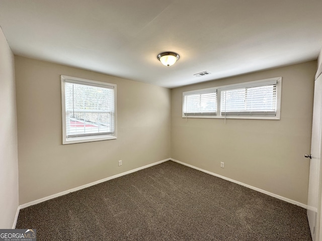 unfurnished room featuring carpet flooring