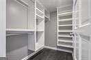 walk in closet with radiator heating unit