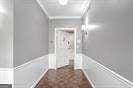 hallway featuring crown molding