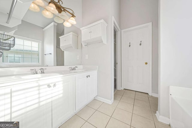 bathroom with tile patterned floors and vanity