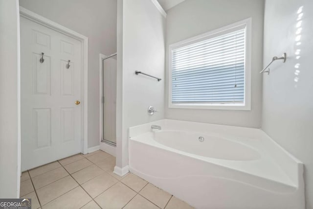 bathroom featuring tile patterned flooring and independent shower and bath