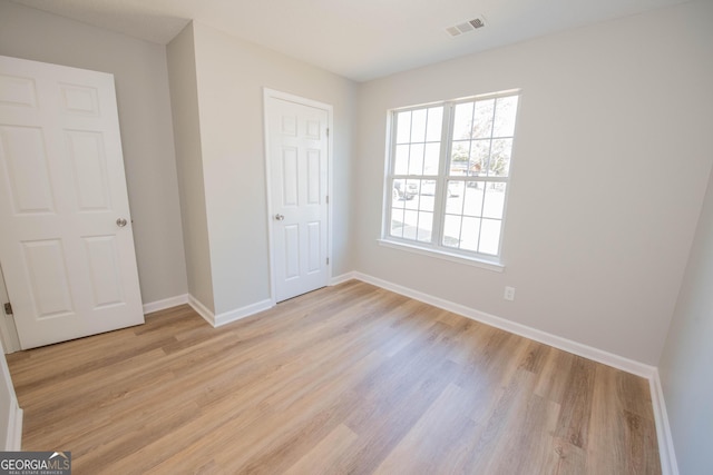 unfurnished bedroom featuring light hardwood / wood-style floors