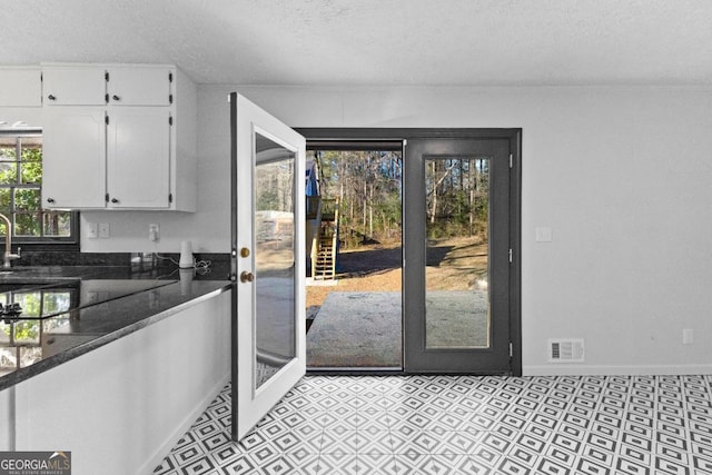 entryway with a textured ceiling