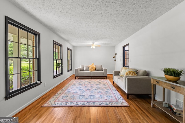 unfurnished bedroom with visible vents, a textured ceiling, baseboards, and light wood-type flooring