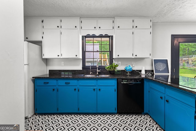 unfurnished room with wood finished floors, baseboards, a textured ceiling, and a wealth of natural light