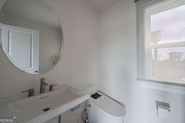 bathroom with sink and toilet