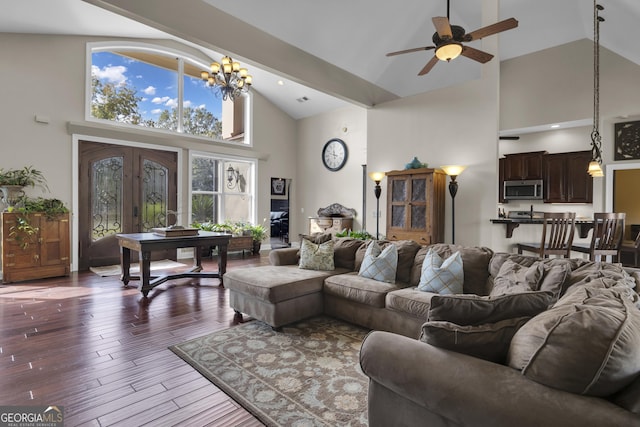 living room featuring ceiling fan with notable chandelier, high vaulted ceiling, dark hardwood / wood-style floors, and french doors