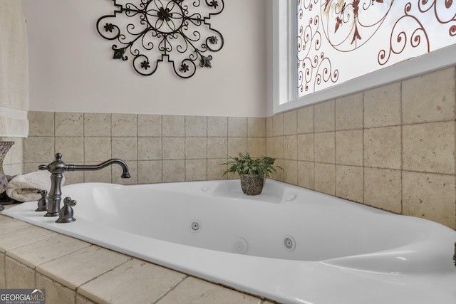 bathroom with tiled tub