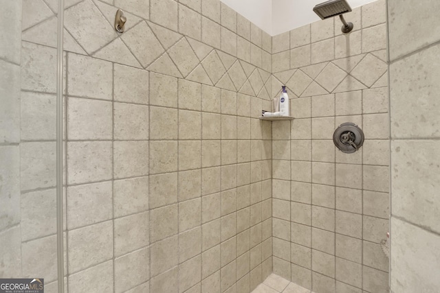 bathroom with tiled shower