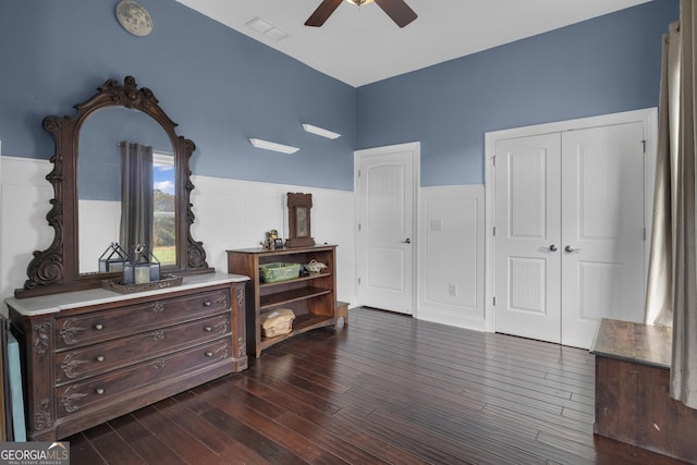 bedroom with ceiling fan, dark hardwood / wood-style floors, and a closet