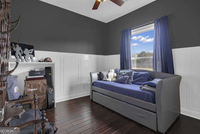 bedroom featuring dark wood-type flooring and ceiling fan