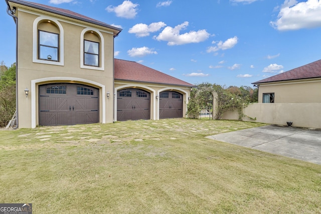 garage with a yard