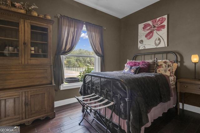 bedroom featuring dark hardwood / wood-style flooring