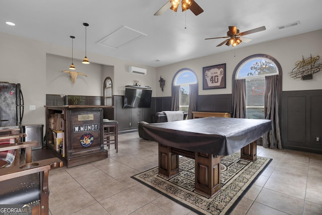 game room with light tile patterned flooring, an AC wall unit, and pool table