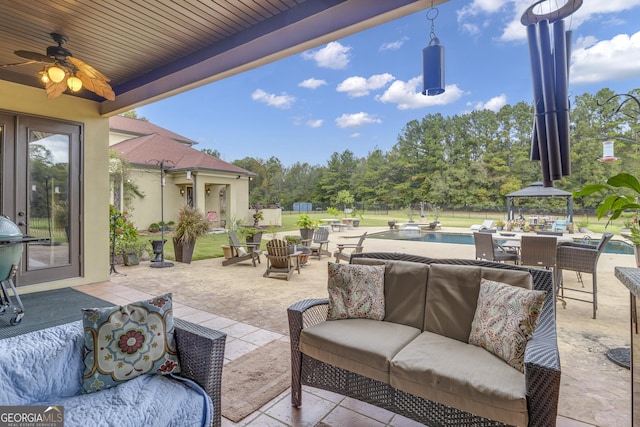 view of patio with a gazebo, ceiling fan, and an outdoor hangout area