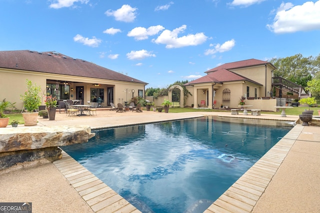 view of swimming pool with a patio