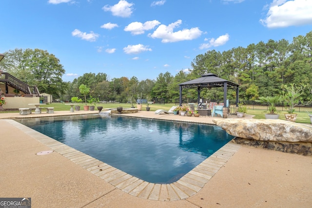 view of swimming pool featuring a gazebo and a patio area