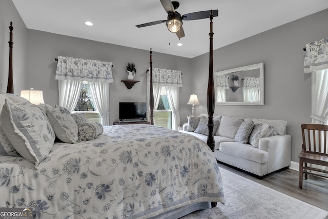 bedroom with hardwood / wood-style floors and ceiling fan