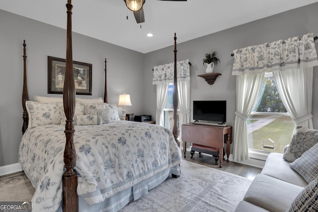 bedroom with wood-type flooring and ceiling fan