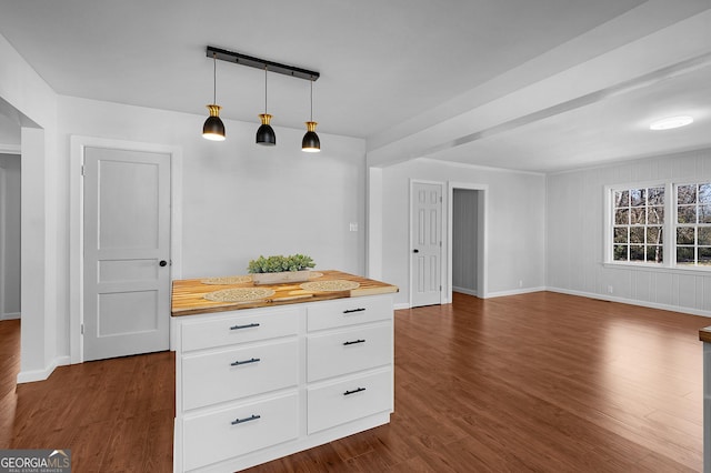 kitchen with white cabinetry, dark hardwood / wood-style floors, and hanging light fixtures