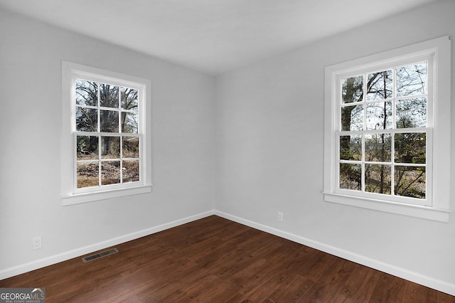 unfurnished room featuring hardwood / wood-style flooring