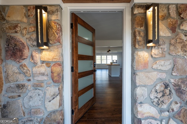 hall with dark hardwood / wood-style flooring