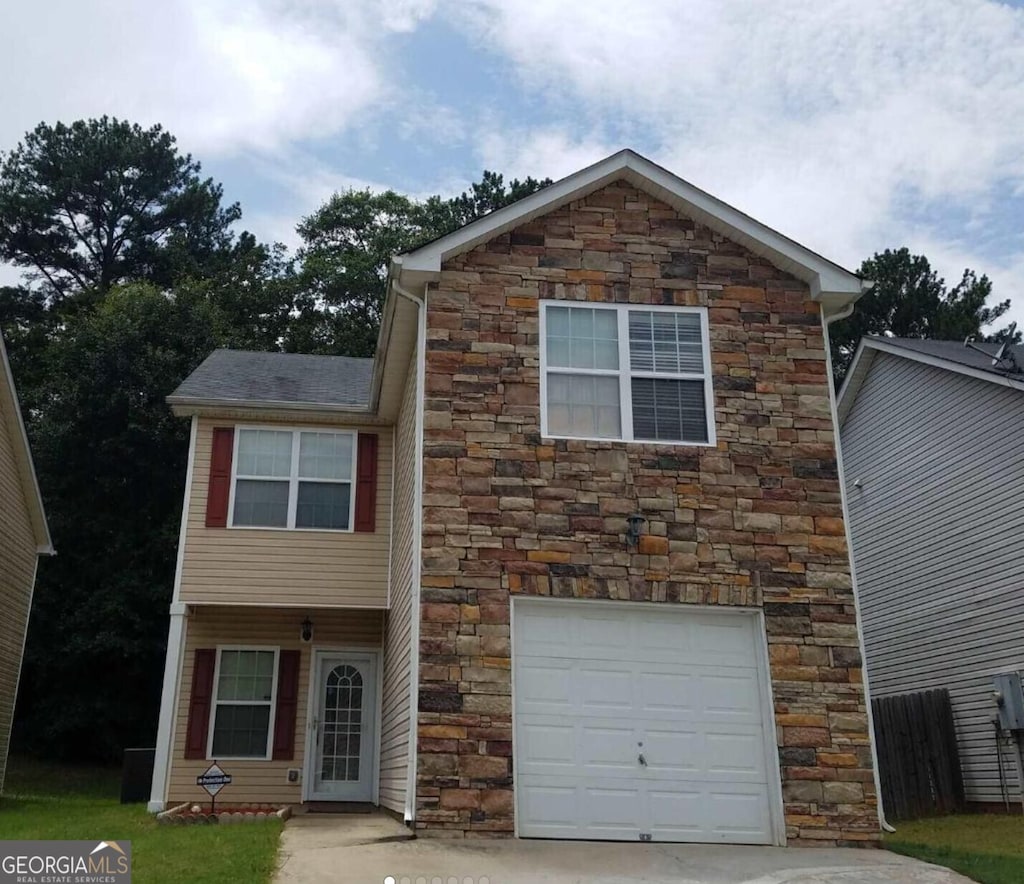 view of front of home with a garage