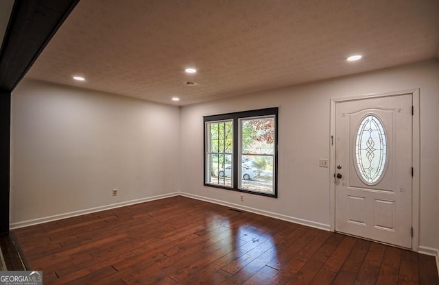 entryway with dark wood-type flooring