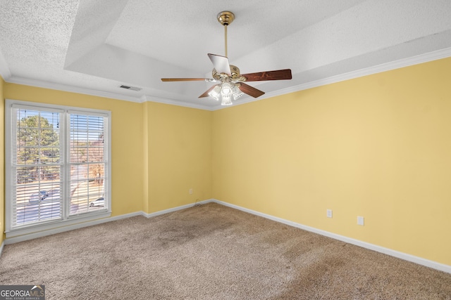 unfurnished room with ceiling fan, ornamental molding, a textured ceiling, and carpet flooring