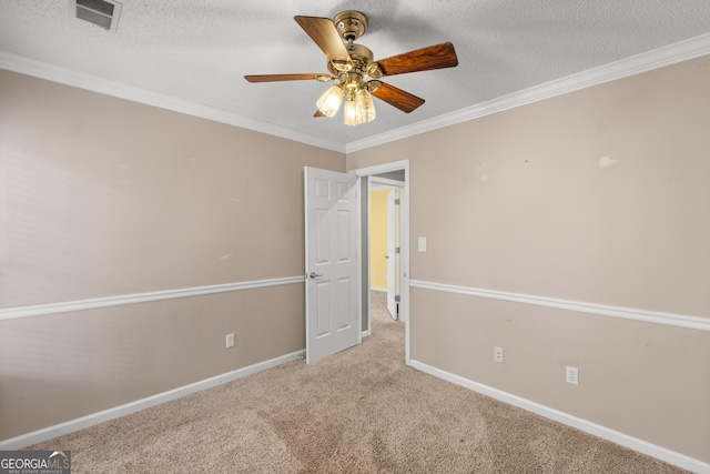 interior space featuring crown molding, light colored carpet, ceiling fan, and a textured ceiling