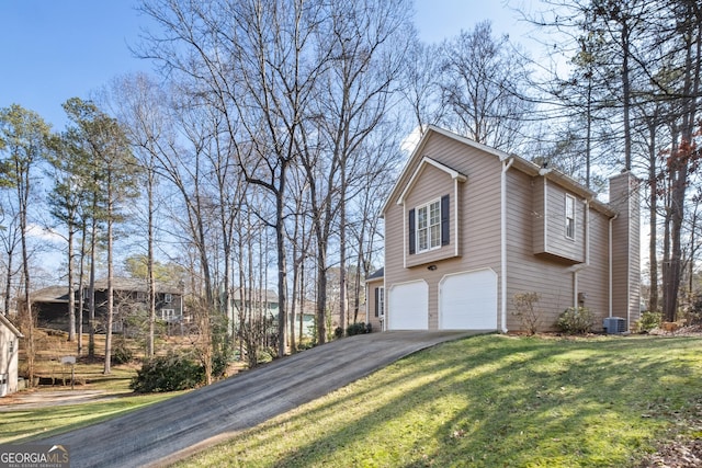 view of property exterior featuring a garage, a yard, and central AC unit