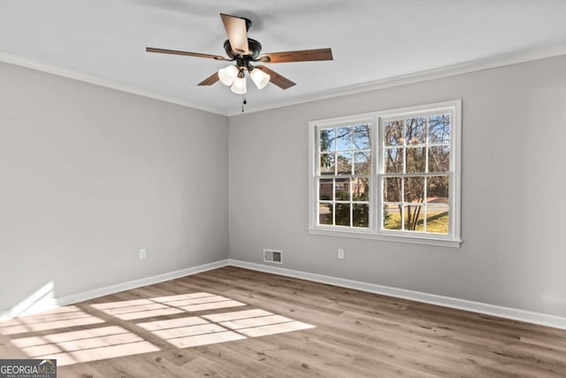 unfurnished room featuring crown molding, ceiling fan, and light wood-type flooring