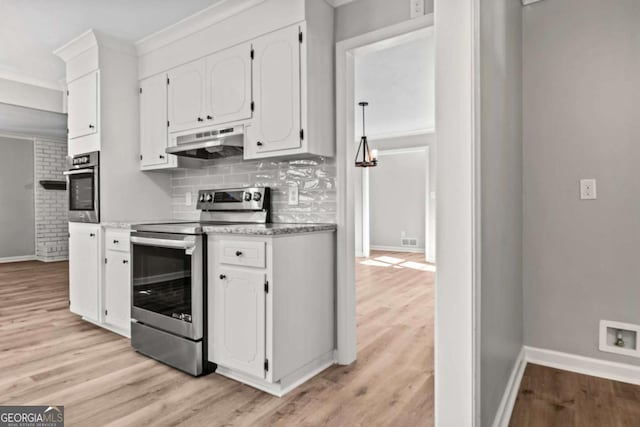 kitchen with white cabinetry, decorative backsplash, ornamental molding, and stainless steel appliances