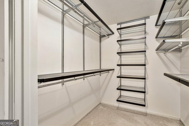 kitchen featuring sink, backsplash, stainless steel appliances, and white cabinets