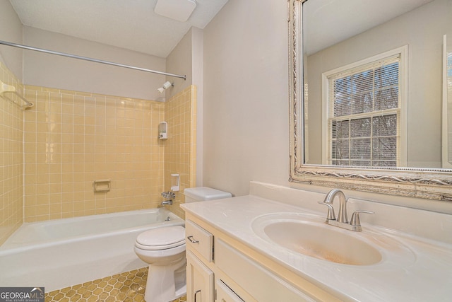 full bathroom with vanity, toilet, and tiled shower / bath combo