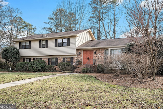 split level home with a front lawn