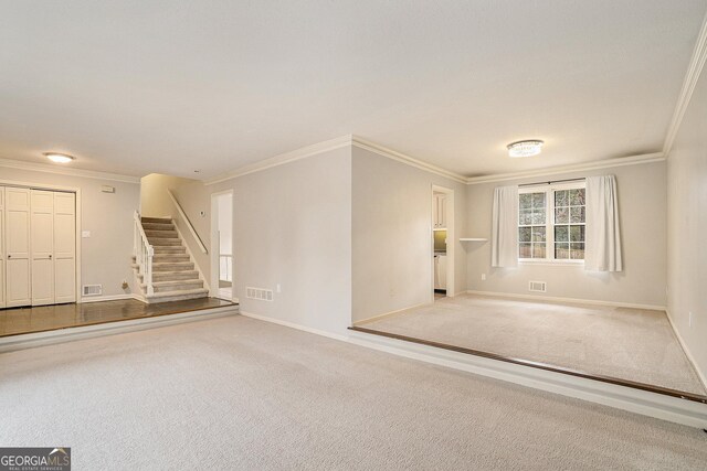 unfurnished bedroom featuring multiple windows, a closet, ceiling fan, and carpet