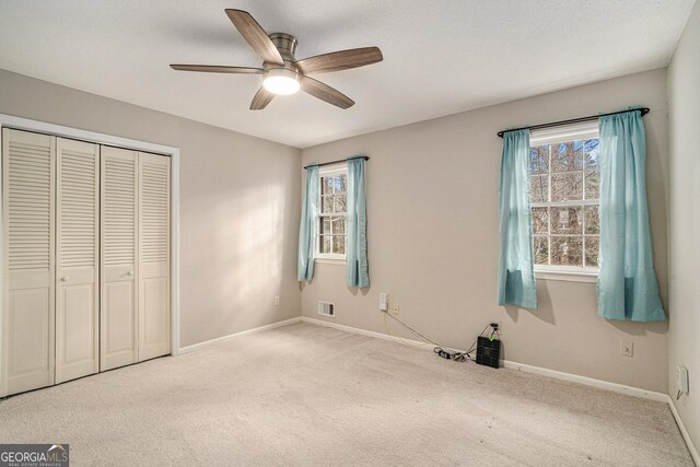 carpeted living room featuring a fireplace