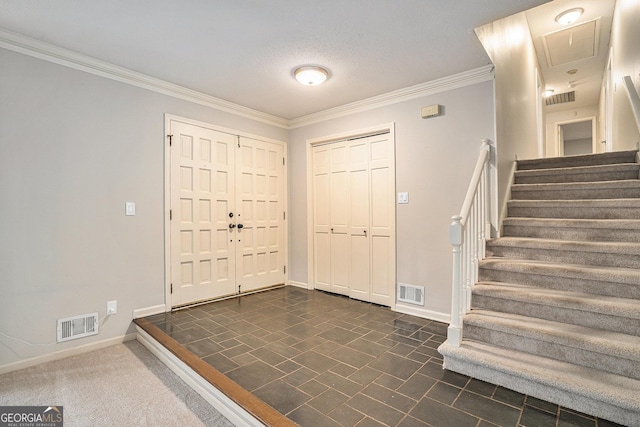 foyer entrance featuring ornamental molding