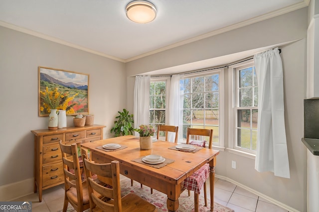 dining space featuring light tile patterned floors and ornamental molding