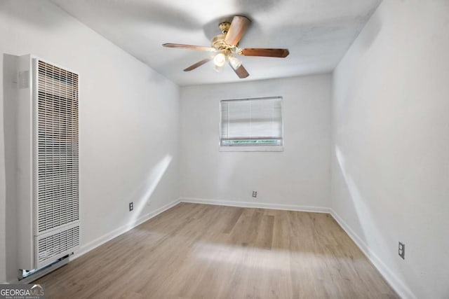 spare room with ceiling fan and light hardwood / wood-style flooring