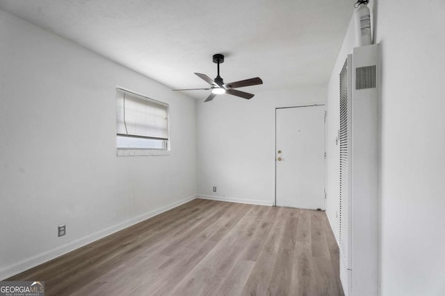 unfurnished bedroom with light hardwood / wood-style flooring and ceiling fan