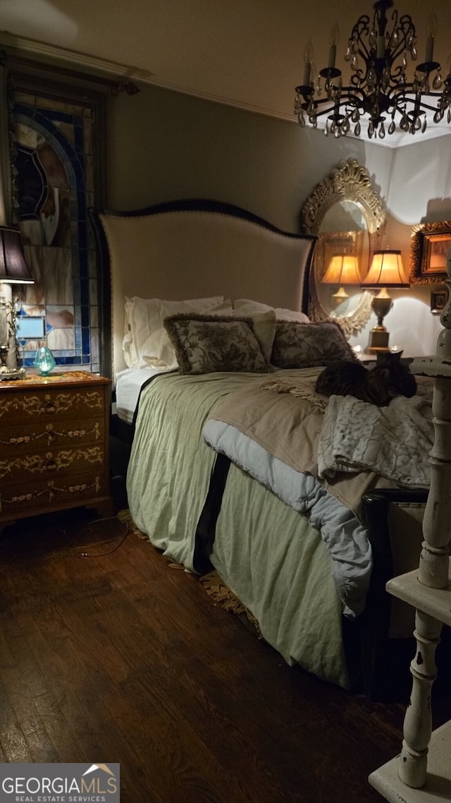 bedroom with wood finished floors