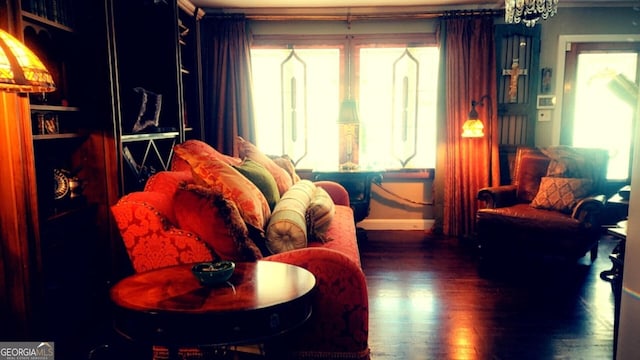 sitting room featuring dark wood-style flooring and baseboards