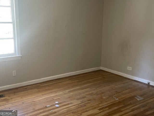 spare room featuring light wood-type flooring