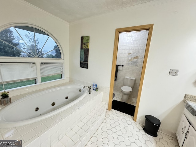bathroom with tiled bath, tile patterned flooring, vanity, ornamental molding, and toilet